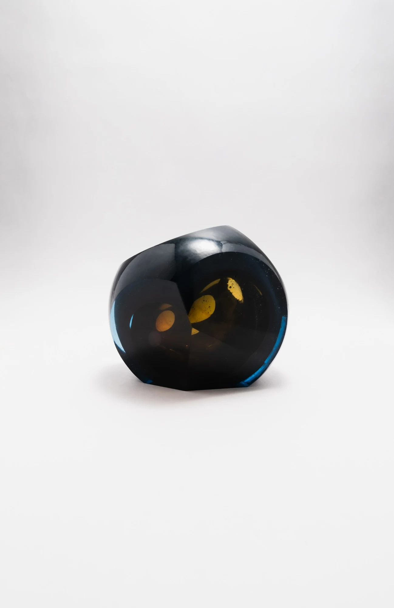 The form turned, amber shapes glowing through an angled cut