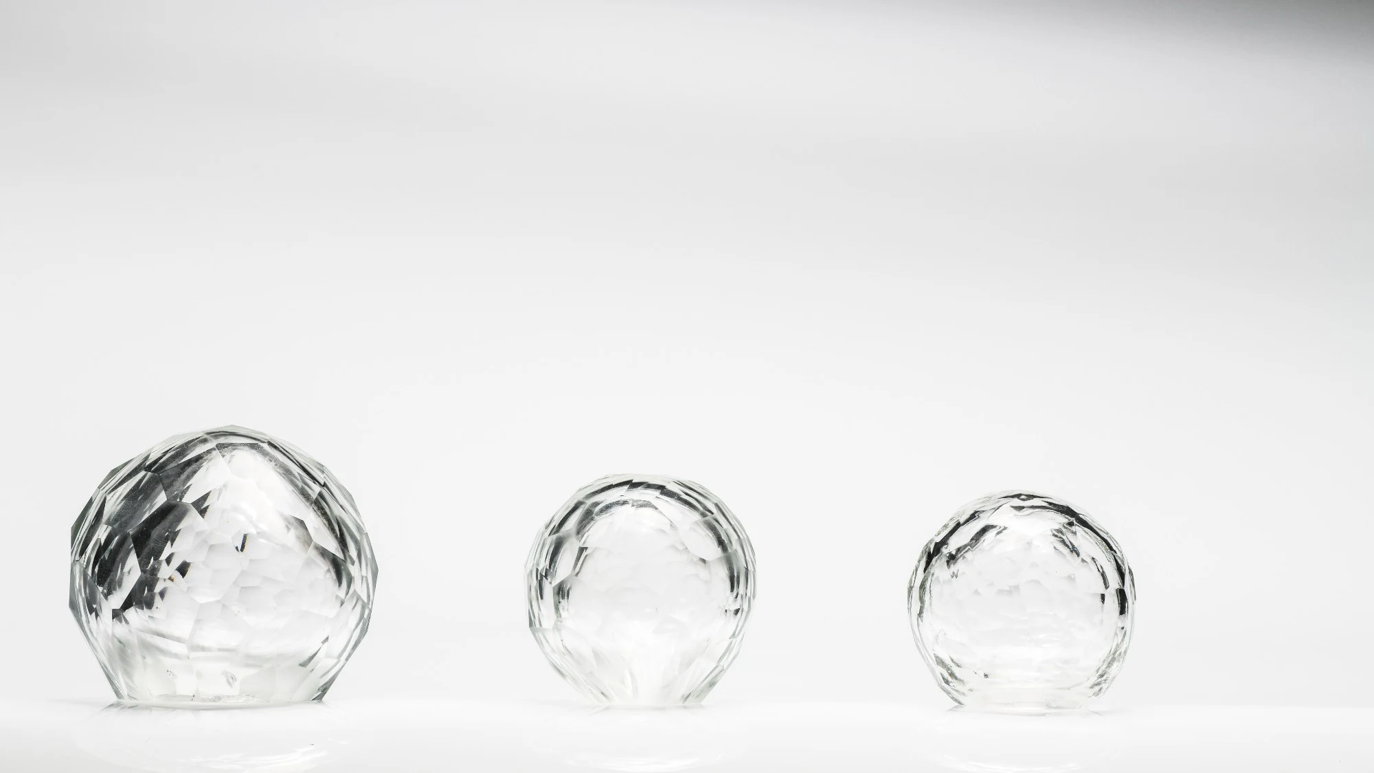 The three spheres seen low and wide, with space above them